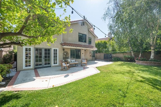 23461 Darcy Ln, Newhall, CA 91321 - back of property featuring stucco siding, a tile roof, a patio, and french doors