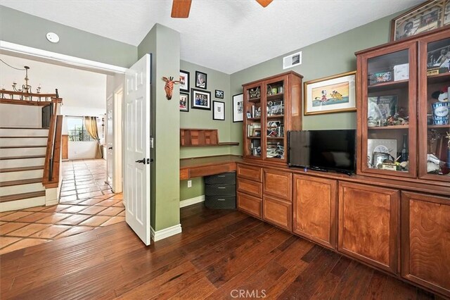 23461 Darcy Ln, Newhall, CA 91321 - office space featuring ceiling fan, built in study area, and dark wood-type flooring