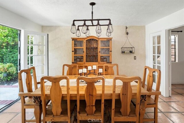 23461 Darcy Ln, Newhall, CA 91321 - dining room with a chandelier and a textured ceiling