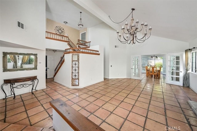 23461 Darcy Ln, Newhall, CA 91321 - unfurnished living room featuring high vaulted ceiling, a chandelier, stairs, and tile patterned flooring