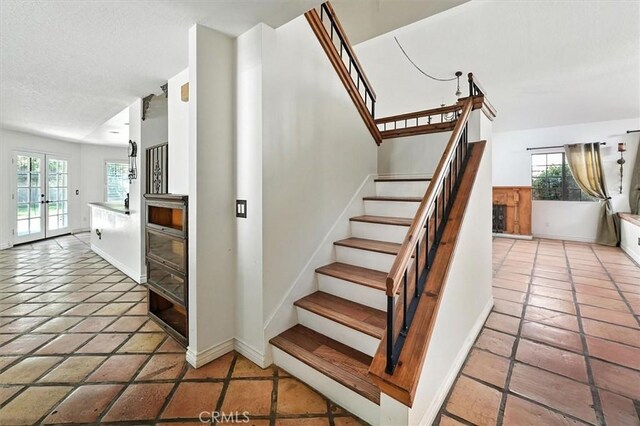 23461 Darcy Ln, Newhall, CA 91321 - stairs with tile patterned floors and a textured ceiling