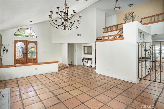 23461 Darcy Ln, Newhall, CA 91321 - unfurnished living room featuring high vaulted ceiling, plenty of natural light, a chandelier, french doors, and tile patterned floors