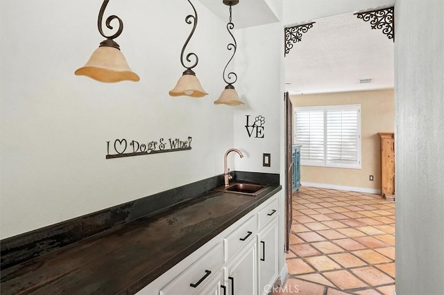 23461 Darcy Ln, Newhall, CA 91321 - indoor wet bar featuring pendant lighting and light tile patterned floors