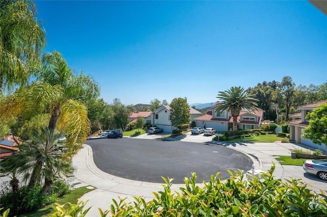 23461 Darcy Ln, Newhall, CA 91321 - view of asphalt street with a residential view and curbs