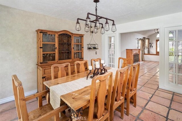 23461 Darcy Ln, Newhall, CA 91321 - dining room featuring a chandelier and a textured ceiling