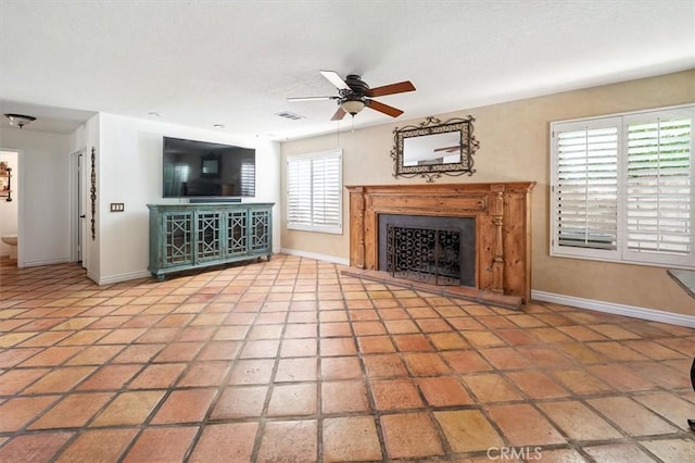 23461 Darcy Ln, Newhall, CA 91321 - unfurnished living room with a fireplace, ceiling fan, and tile patterned flooring