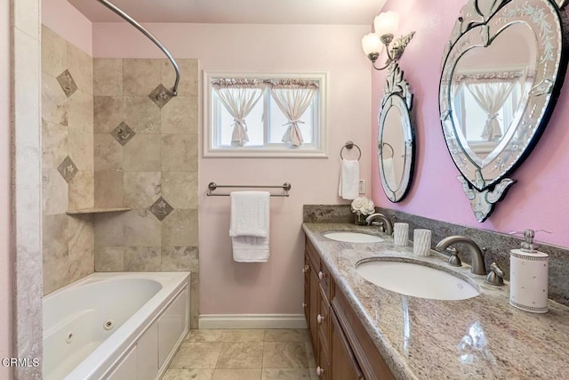 full bathroom with a sink, baseboards, double vanity, and a combined bath / shower with jetted tub