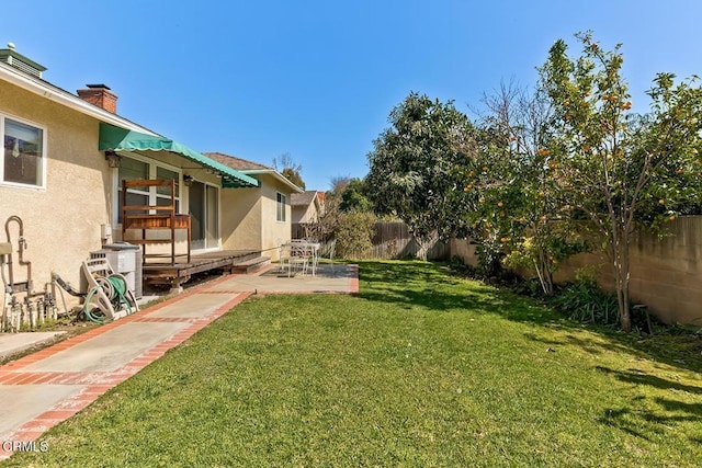 view of yard featuring a patio and a fenced backyard