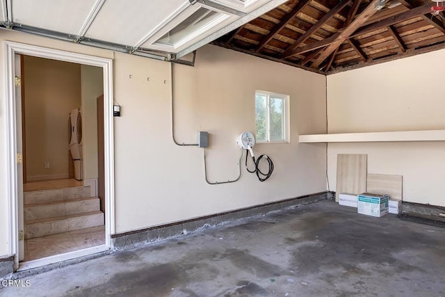 garage featuring baseboards