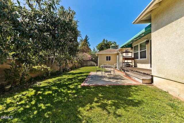 view of yard with a patio area and a fenced backyard