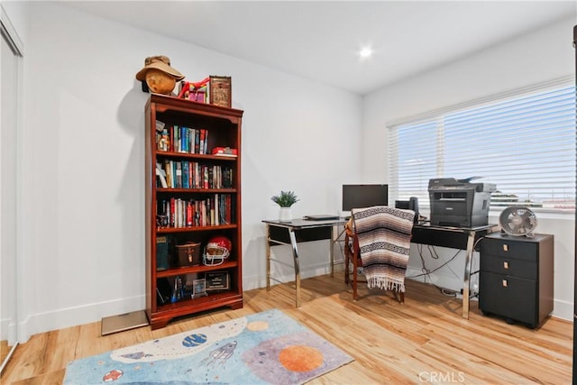 office area featuring wood finished floors and baseboards