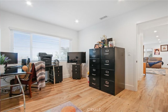 office area featuring recessed lighting, visible vents, light wood-type flooring, and baseboards