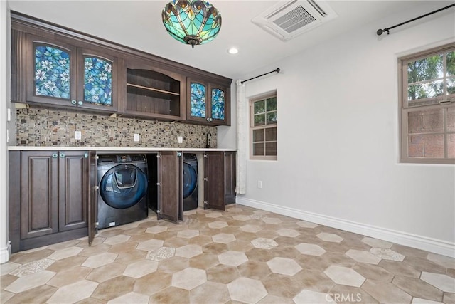 washroom featuring visible vents, a sink, recessed lighting, cabinet space, and baseboards