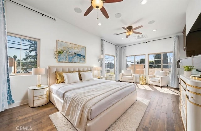 bedroom featuring recessed lighting, wood finished floors, visible vents, and ceiling fan