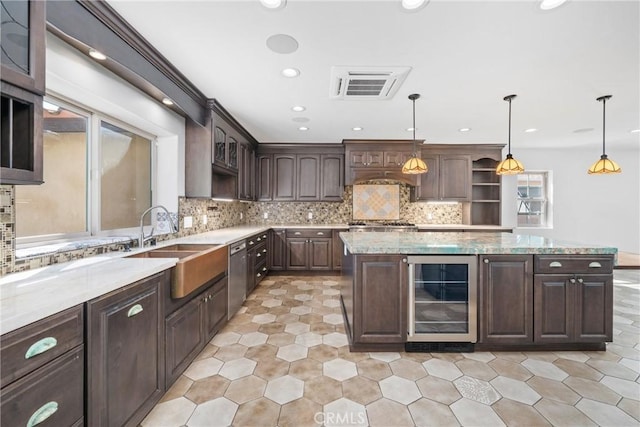 kitchen with open shelves, wine cooler, dark brown cabinetry, dishwasher, and a sink