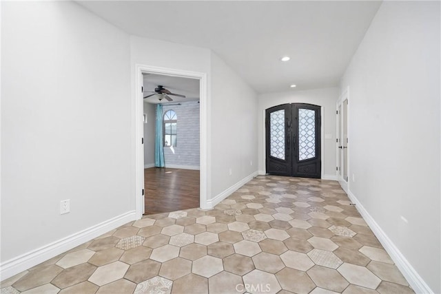 foyer entrance with recessed lighting, french doors, and baseboards