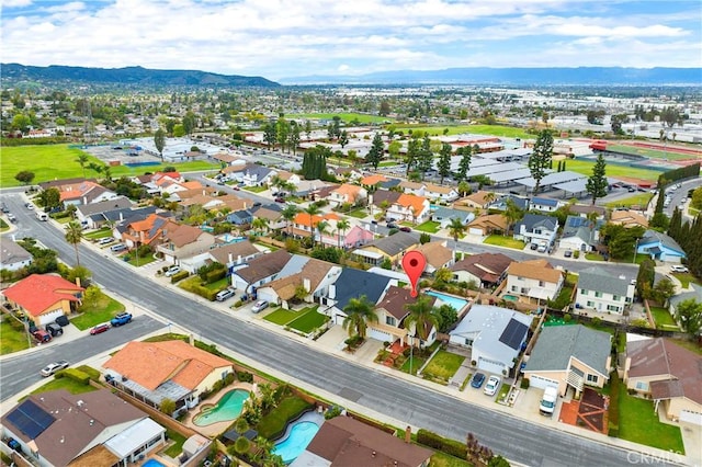 drone / aerial view with a residential view and a mountain view