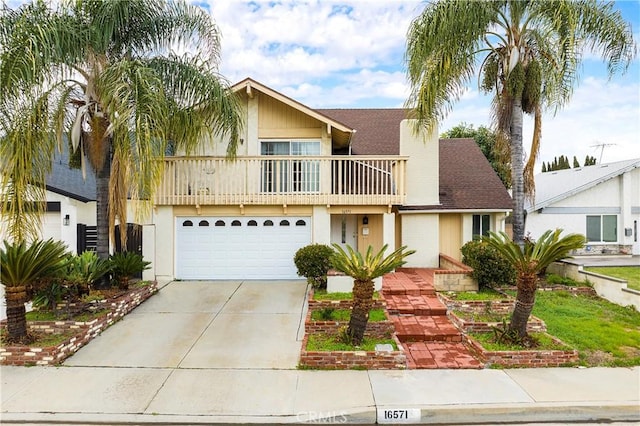 front facade with a shingled roof, stucco siding, a balcony, a garage, and driveway