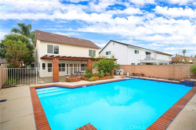 view of pool featuring a patio area, a fenced in pool, and a fenced backyard