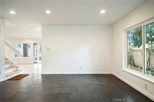 spare room with stairway, recessed lighting, baseboards, and wood tiled floor