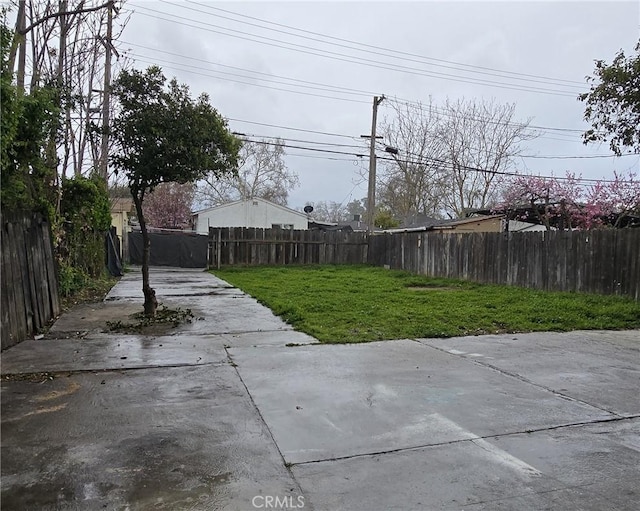 view of yard with fence private yard and a patio