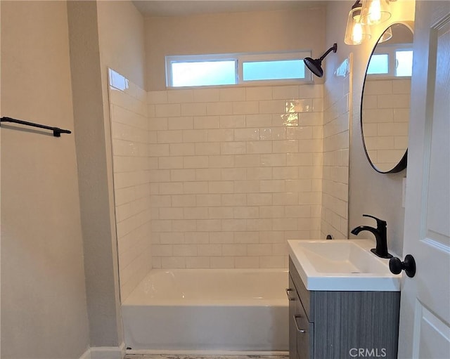 bathroom with bathing tub / shower combination and vanity