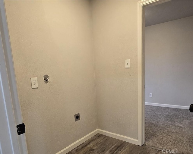 laundry room featuring dark wood-style floors, laundry area, hookup for an electric dryer, and baseboards