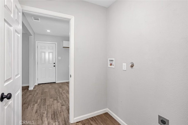 laundry room featuring washer hookup, wood finished floors, electric dryer hookup, baseboards, and visible vents