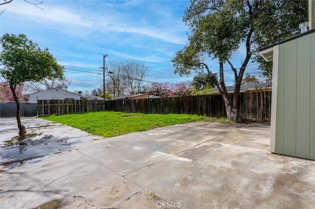 view of yard with fence private yard and a patio area