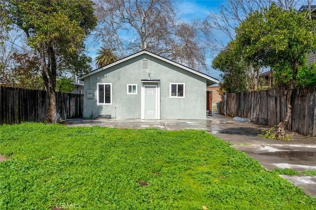 view of outbuilding with fence