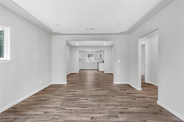 interior space with wood finished floors, recessed lighting, baseboards, and visible vents