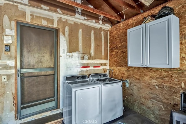 clothes washing area with separate washer and dryer