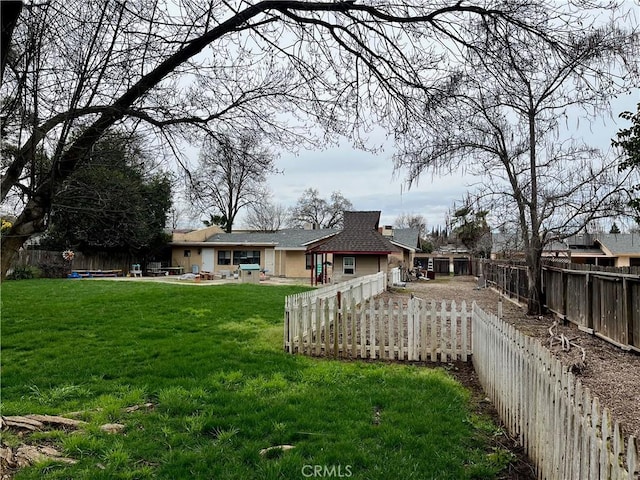 view of yard featuring a patio and a fenced backyard