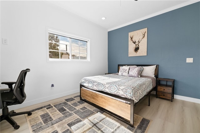 bedroom featuring recessed lighting, baseboards, wood finished floors, and ornamental molding