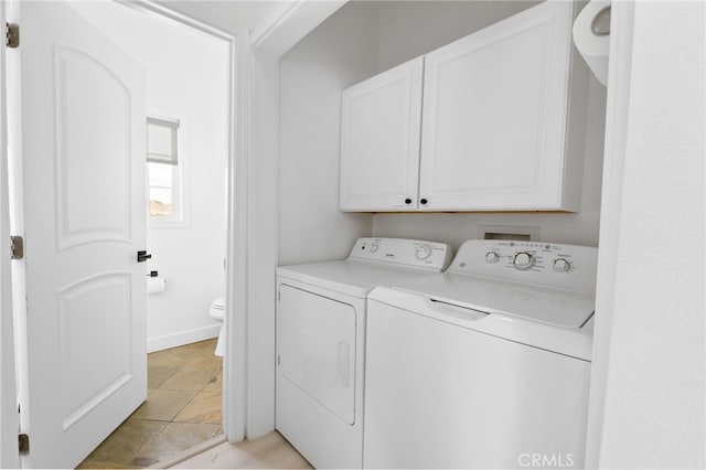 laundry room with cabinet space and washing machine and dryer