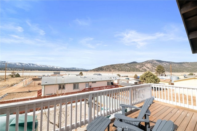 wooden deck featuring a mountain view