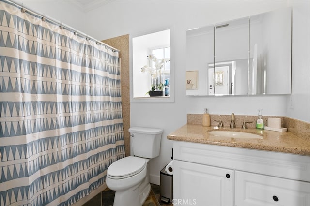 bathroom featuring a shower with shower curtain, toilet, and vanity