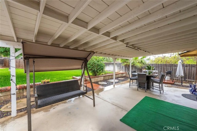 view of patio / terrace featuring a fenced backyard and outdoor dining space