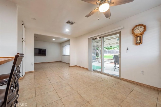 empty room with visible vents, baseboards, light tile patterned floors, recessed lighting, and a ceiling fan