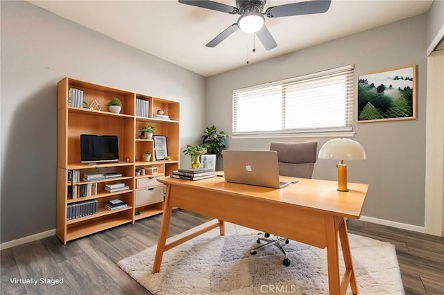 office area featuring baseboards, wood finished floors, and a ceiling fan