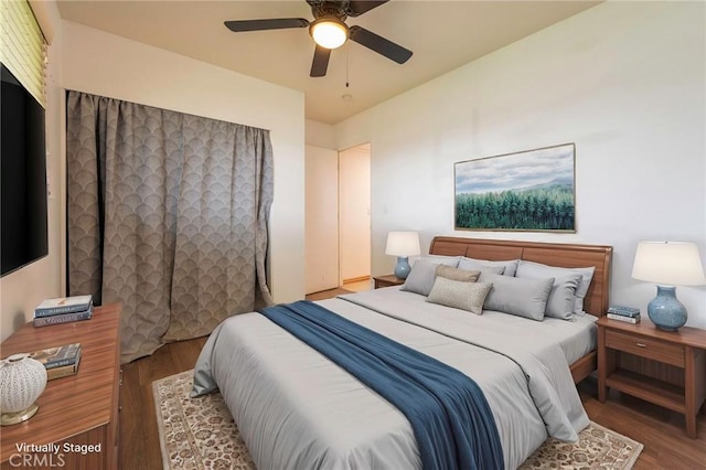 bedroom featuring ceiling fan and wood finished floors