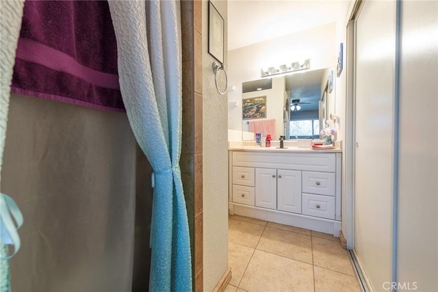 bathroom featuring tile patterned floors, curtained shower, and vanity