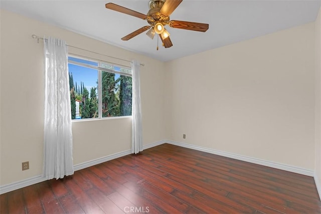 empty room featuring baseboards, wood-type flooring, and ceiling fan