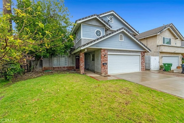 traditional-style house with driveway, fence, an attached garage, a front yard, and brick siding