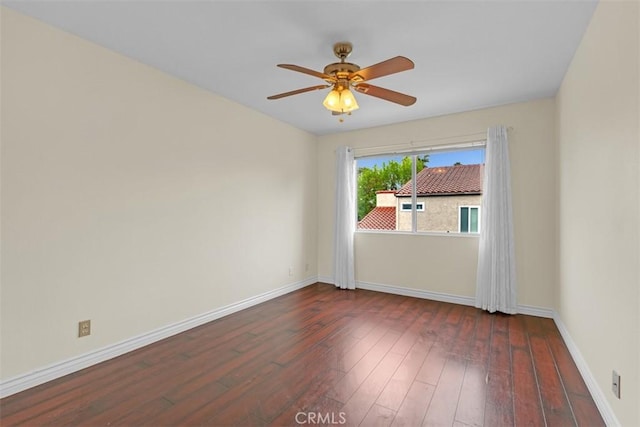 unfurnished room featuring hardwood / wood-style flooring, baseboards, and ceiling fan