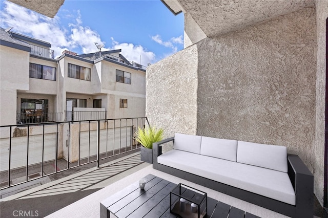 view of patio / terrace with an outdoor living space and a balcony