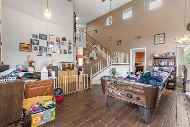 interior space featuring visible vents, a healthy amount of sunlight, and wood finish floors