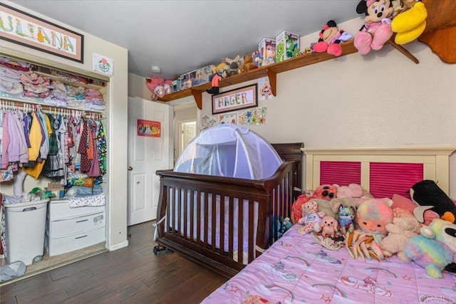 bedroom featuring wood finished floors and a closet