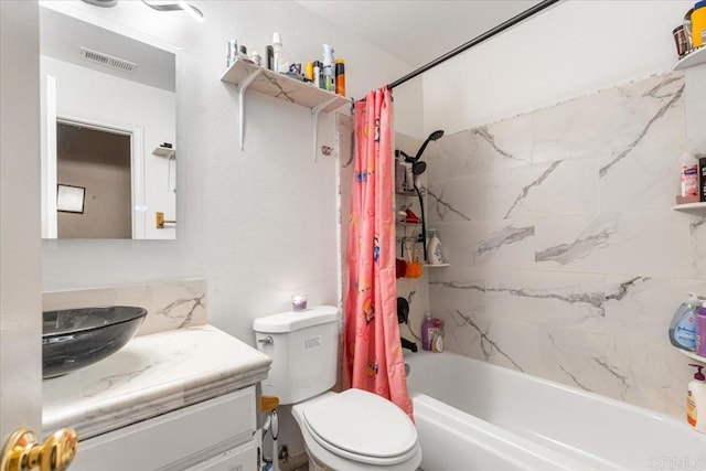 full bath featuring visible vents, toilet, vanity, and shower / bath combination with curtain