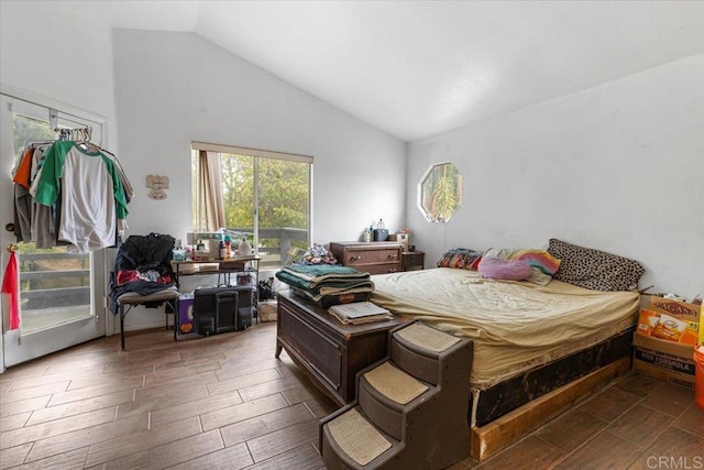 bedroom with wood tiled floor and vaulted ceiling